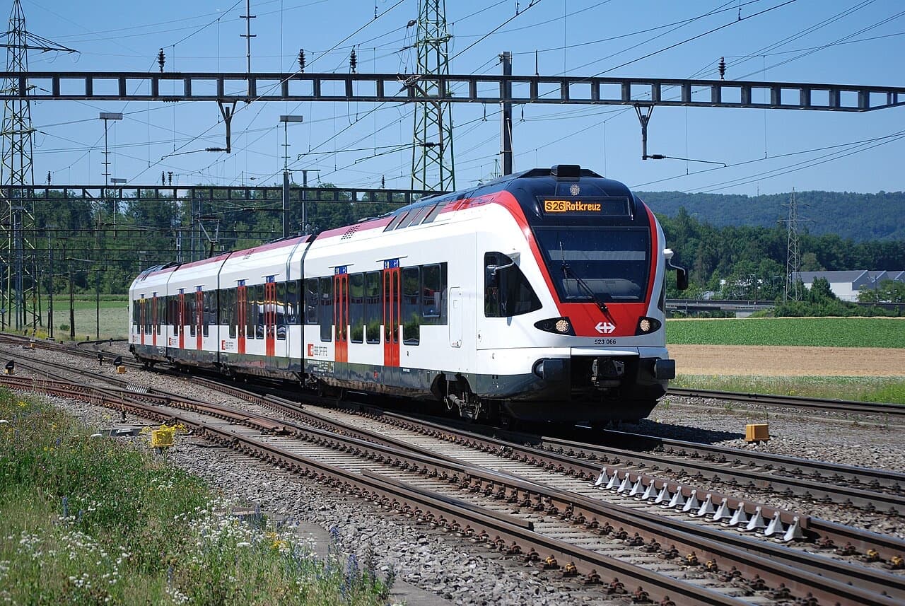 SBB RABe 523 FLIRT in red and white livery running as S26 near Hendschiken