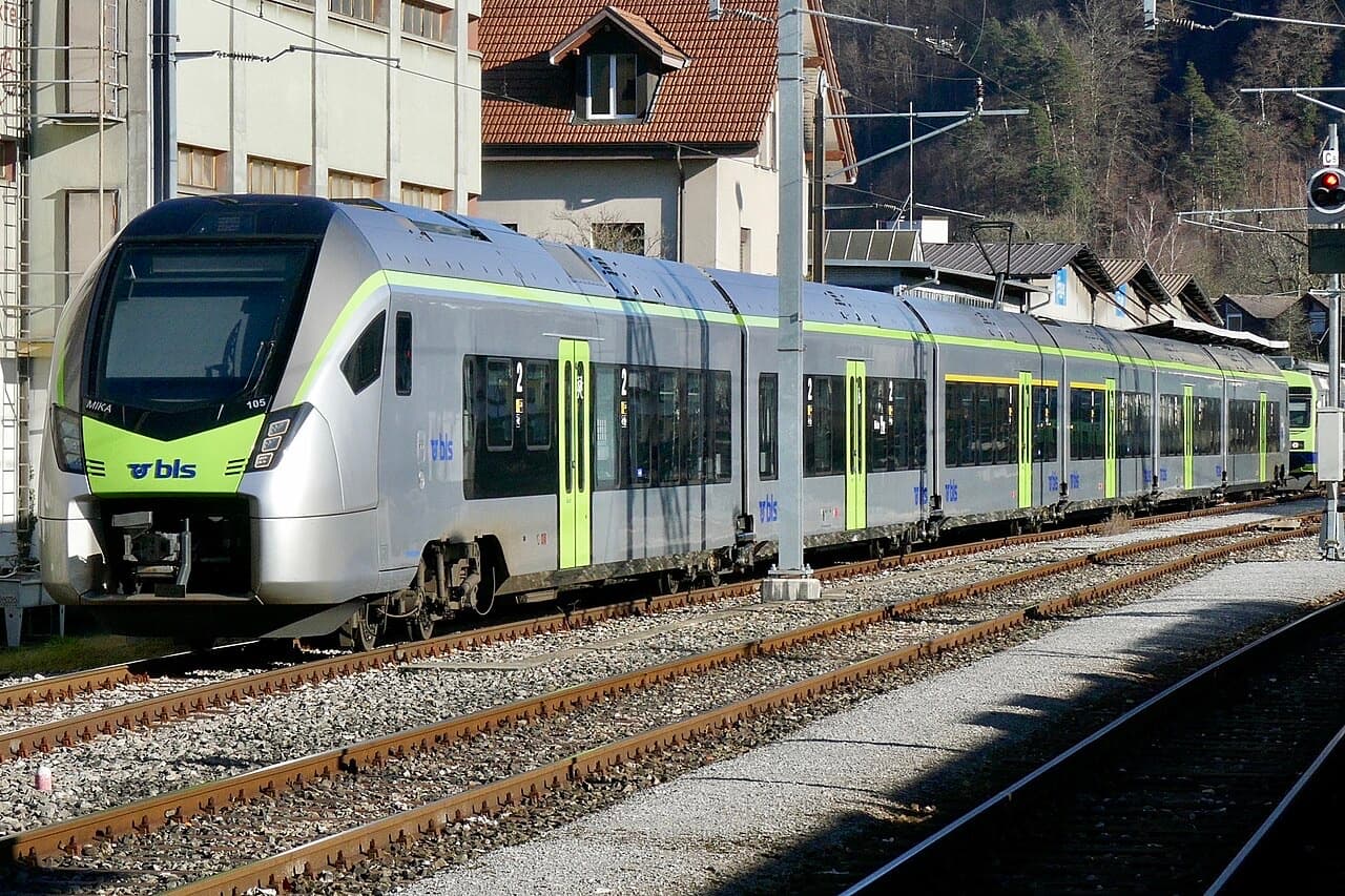 BLS RABe 528 MIKA parked beside Burgdorf station, whole train in silver and green